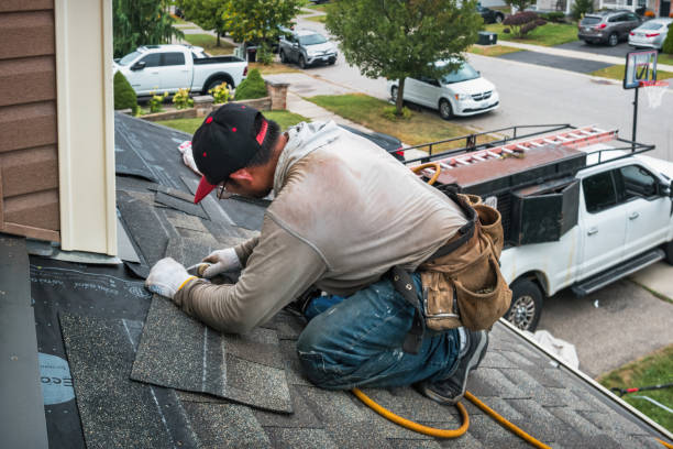 Professional Roofing technician working in Nichols, IA